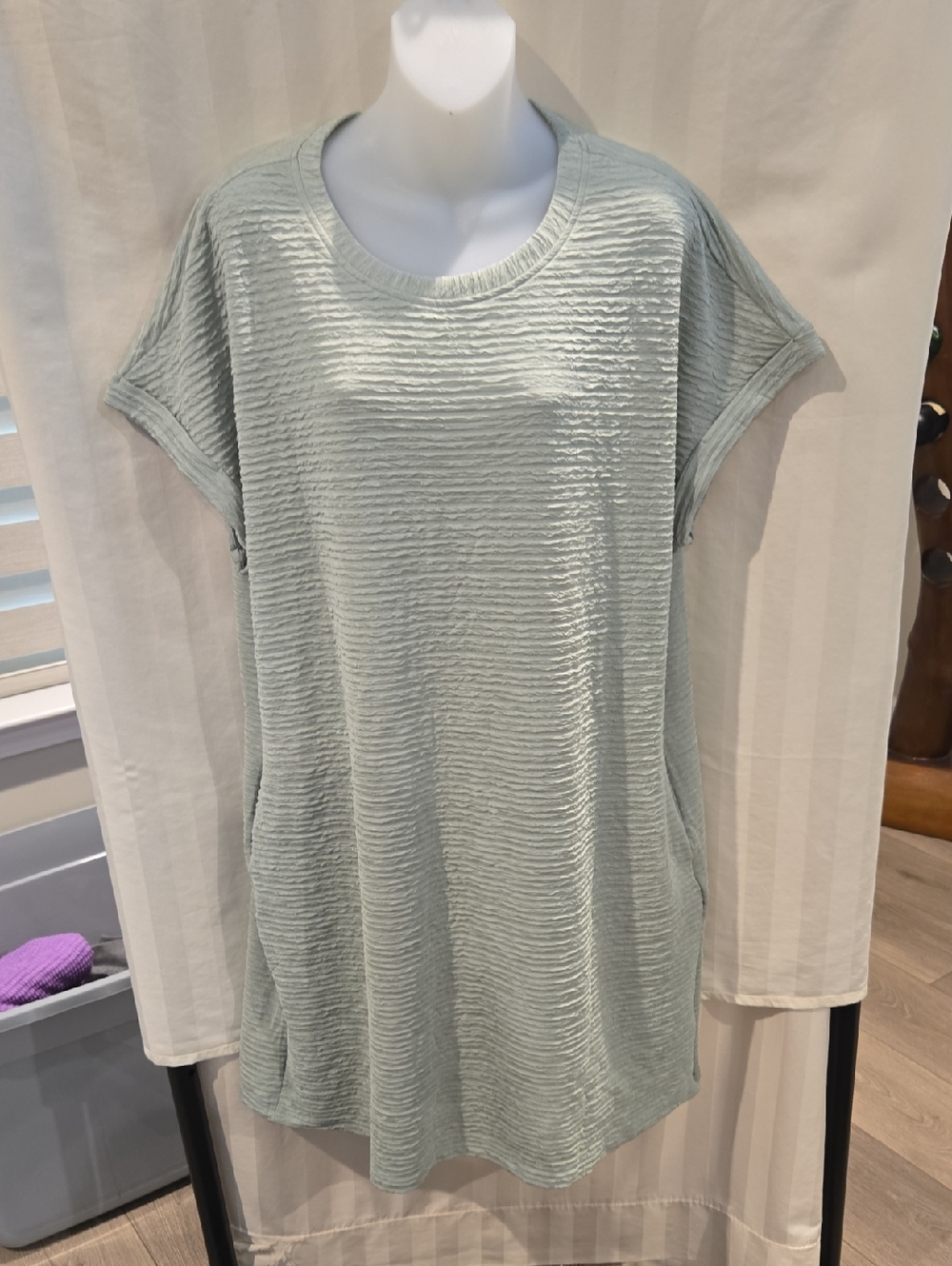 Soft, light sage short-sleeve top with subtle ribbed texture. Lightweight